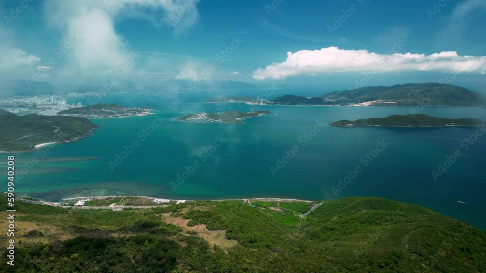 Drone shot over seashore Vietman is famous tourist destination.Top view traffic road around the beach.Aerial drone top down view curves of coastal road Nha Trang Vietnam beautiful Top view seashore.4K
