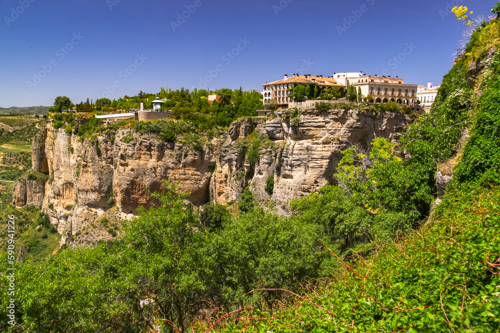 Buildings on the picturesque cliffs of the gorge at the town of Ronda, Andalusia, Spain