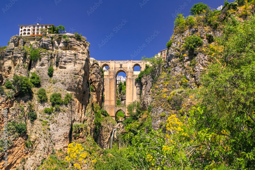 Fototapeta premium The spectacular bridge Puente Nuevo between rocks on which rests the city of Ronda, Andalusia, Spain