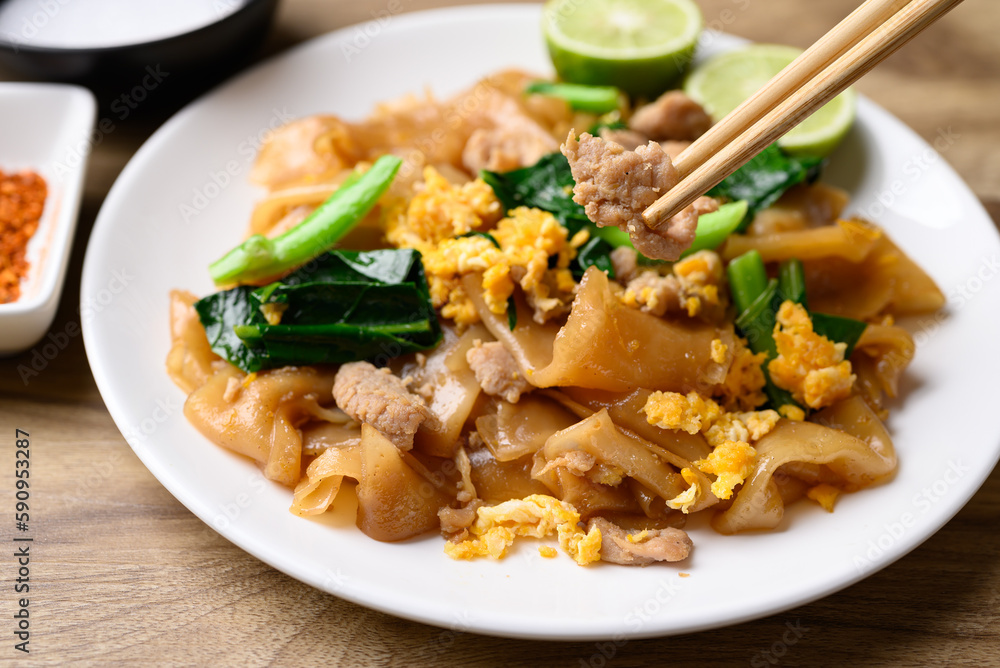 Thai food (Pad See Ew), Stir fried rice noodles soy sauce with pork, egg and kale