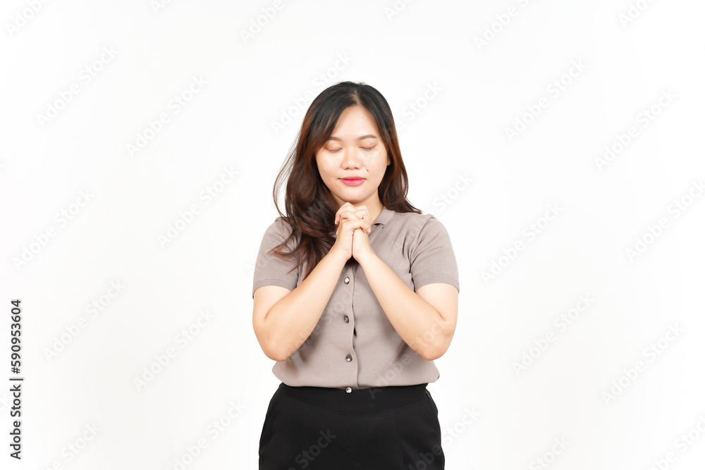 Folding hand and praying Of Beautiful Asian Woman Isolated On White Background Folding hand and praying Of Beautiful Asian Woman Isolated On White Background