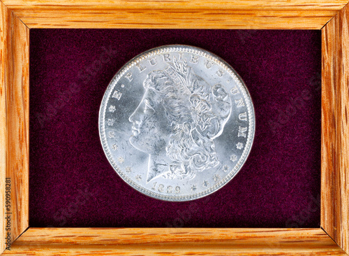 Single old United States silver morgan dollar coin in felt jewelry box