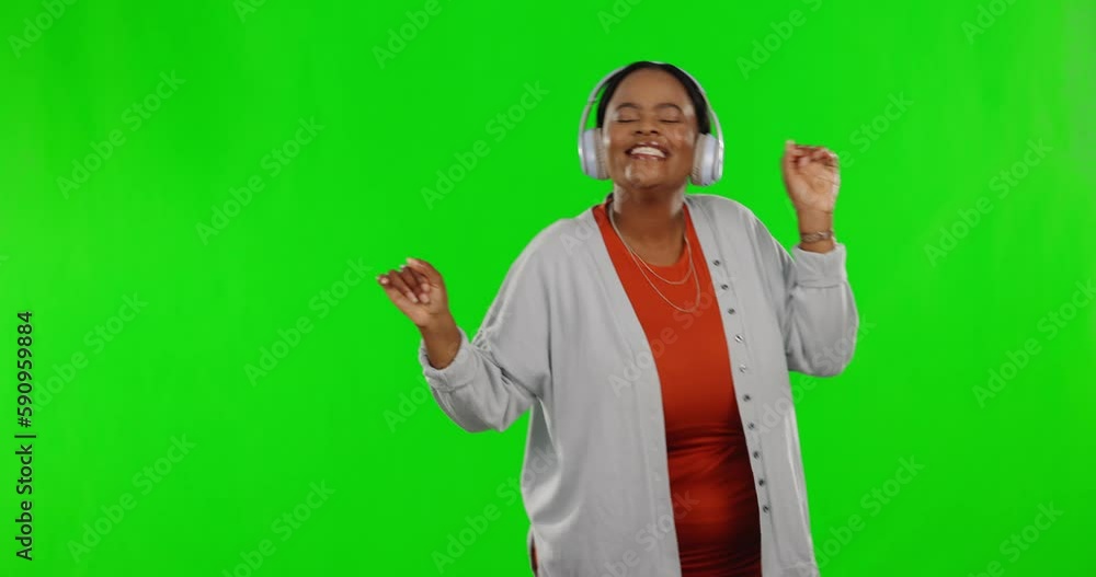 Black woman on green screen, headphones and dancing while listening to music, freedom and fun with happiness. Female is carefree, smile with entertainment and energy, mockup space and radio streaming Black woman on green screen, headphones and dancing while listening to music, freedom and fun with happiness. Female is carefree, smile with entertainment and energy, mockup space and radio streaming