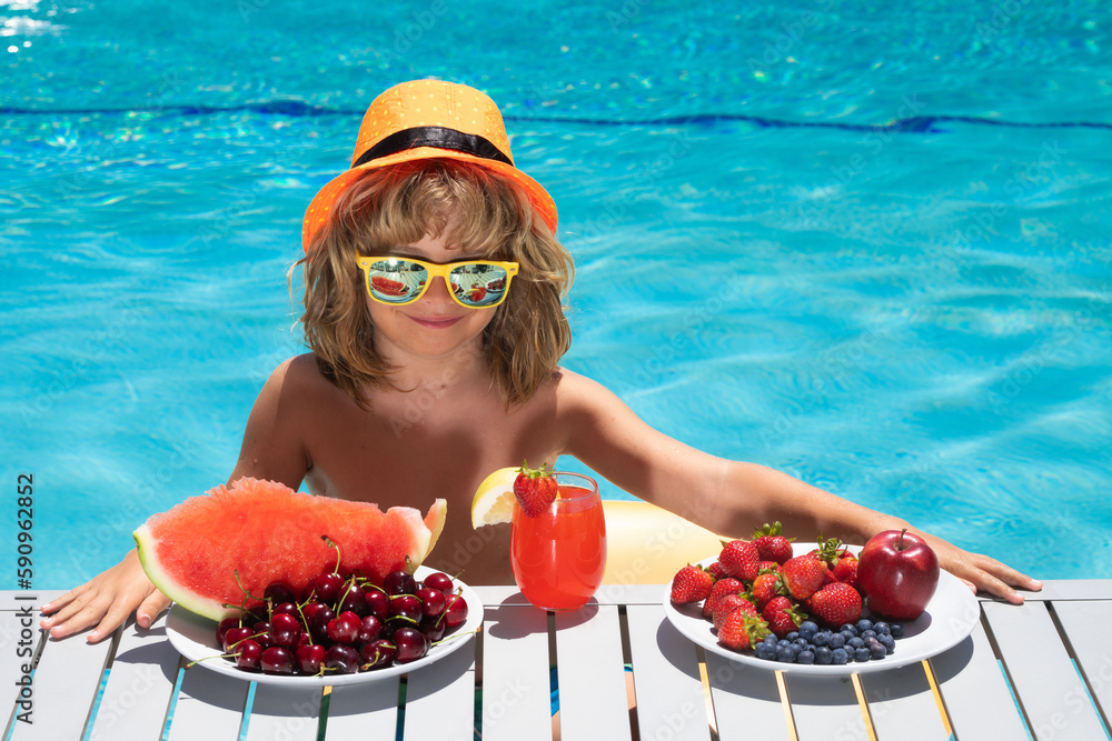 Portrait of summer kids. Child in swimming pool with summer fruits. Kids summer vacation. Beach and sea water fun. Summer vacation and holidays, healthy eating for kids. Portrait of summer kids. Child in swimming pool with summer fruits. Kids summer vacation. Beach and sea water fun. Summer vacation and holidays, healthy eating for kids.