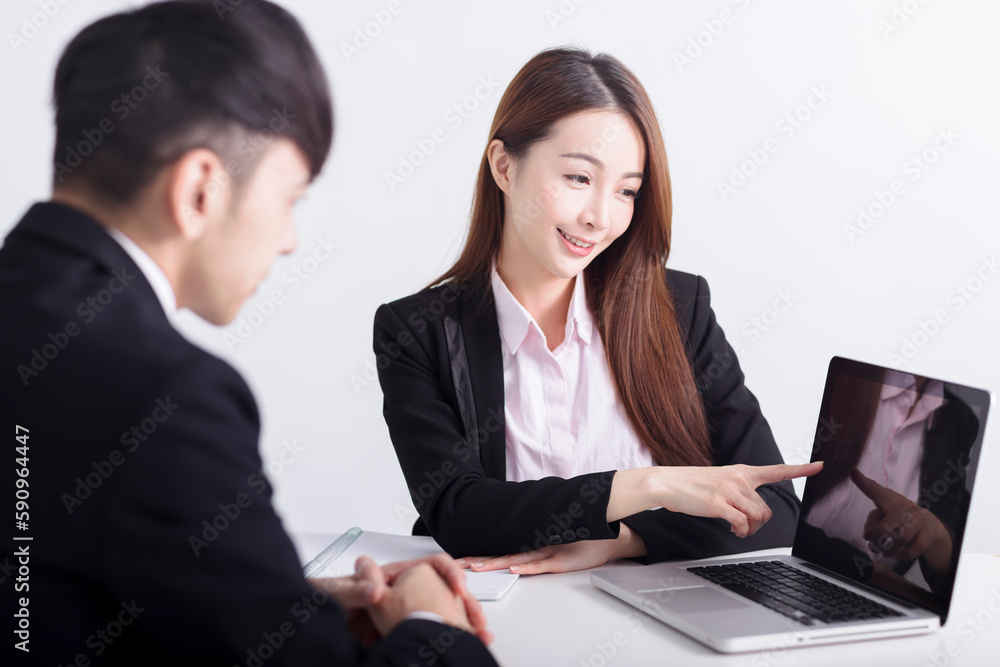 Business women are introducing or consulting businesses to male employees with laptop Business women are introducing or consulting businesses to male employees with laptop