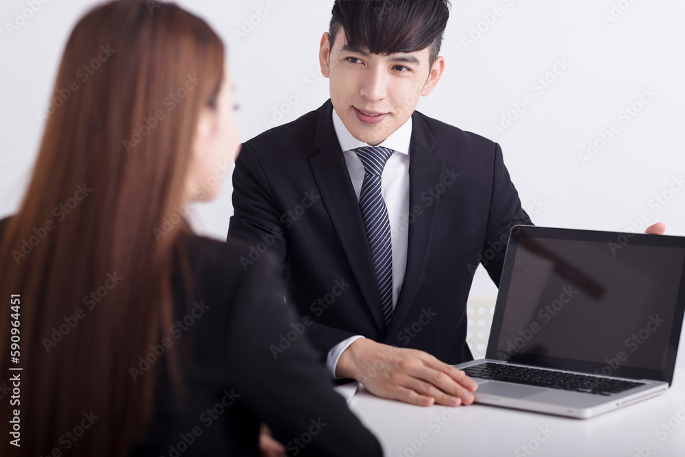 Business men are introducing or consulting businesses to female employees with laptop Business men are introducing or consulting businesses to female employees with laptop