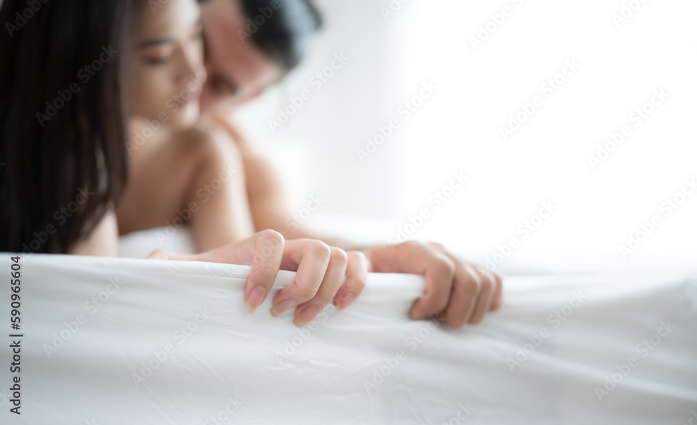 Gorgeous sexy couple enjoying sex in the house's bedroom, Concept of as emotional relationships passion and love