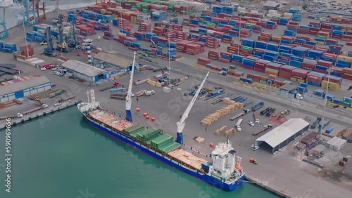 High angle view over Haina Port where freight is unloaded onto dock photo