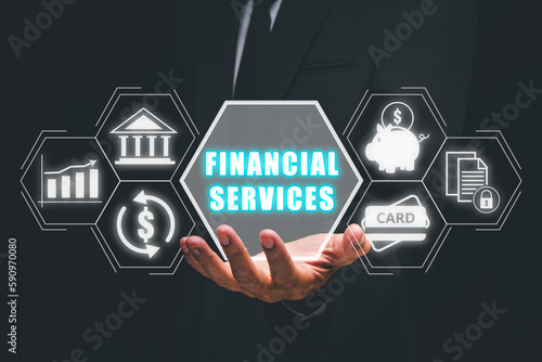Business Finance, accounting, Businessman hand holding financial service icon on virtual screen.
