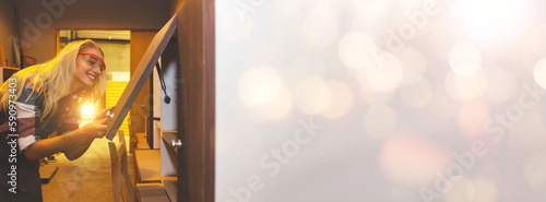 Female carpenter worker woodworking designer furniture small home and office cabinets made of plywood and inspect open and close view beautiful and safe designs prepare to be shipped furniture store.