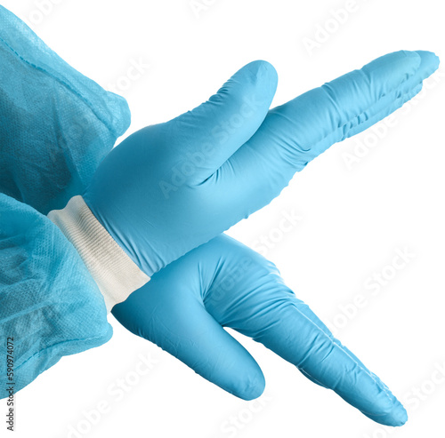 A medic's with a medical mask and hands in latex glove shows the symbol of the cross.