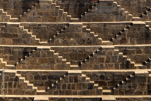 Ancient Indian step well in Jaipur, India, Architecture of stairs at Abhaneri Baori step well in Jaipur, Rajasthan, India. photo