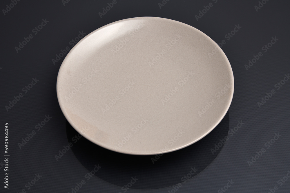 Empty plate on black background Empty plate on black background