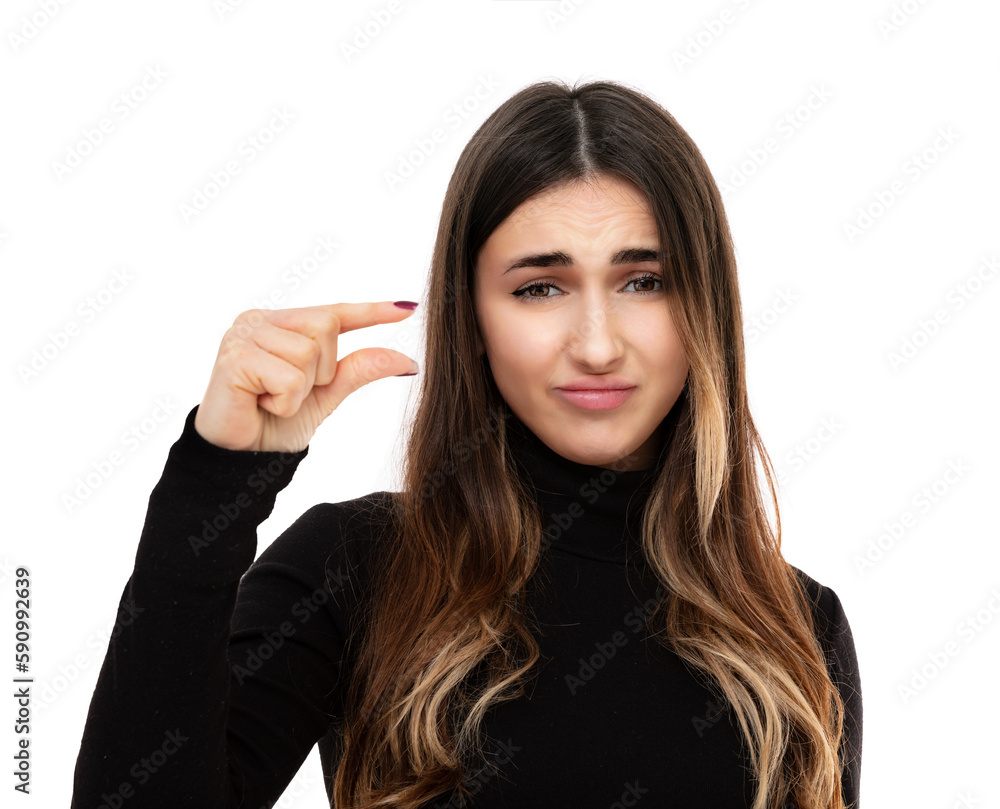 Portrait of sed twenty year old girl shapes little gesture with hand demonstrates something very tiny small size isolated on white. Not very much. Brunette with long highlighted hair posing in studio. Portrait of sed twenty year old girl shapes little gesture with hand demonstrates something very tiny small size isolated on white. Not very much. Brunette with long highlighted hair posing in studio.