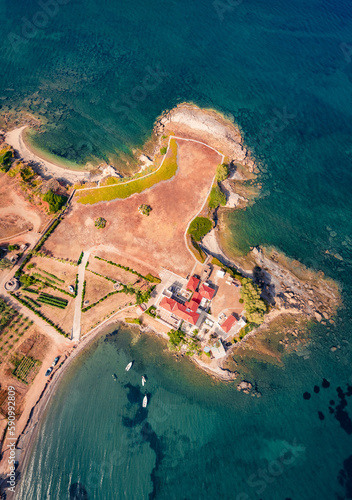 Stright down view of Xifias port, Greece, Europe. Beautiful summer scene of Peloponnese peninsula. Sunny morning seascape of Myrtoan Sea. Vacation concept background.. photo