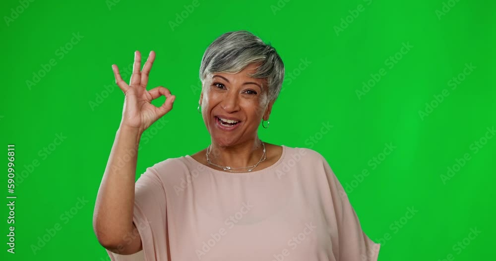 Smile, green screen and okay hand gesture, portrait of woman on studio background with mock up and positive opinion. Happy mature model, ok sign language and happiness with agreement on poll or vote. Smile, green screen and okay hand gesture, portrait of woman on studio background with mock up and positive opinion. Happy mature model, ok sign language and happiness with agreement on poll or vote.