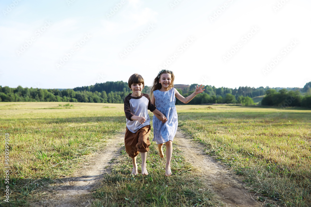 Children walk in the summer in nature. Child on a sunny spring morning in the park. Traveling with children. Children walk in the summer in nature. Child on a sunny spring morning in the park. Traveling with children.