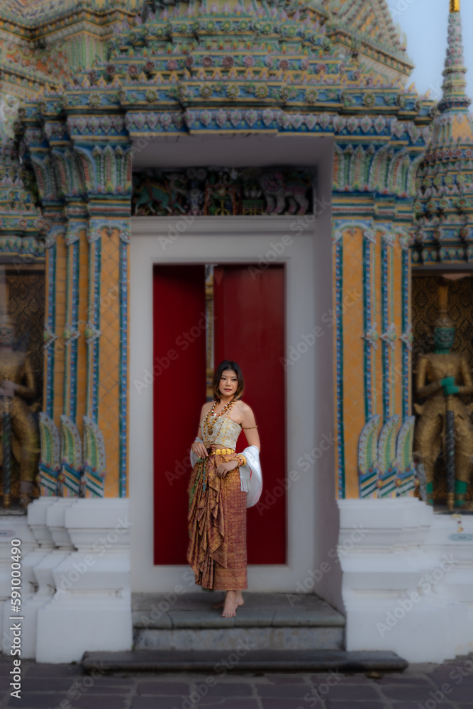 Portrait of Thai woman wearing Thai traditional at War Pho, Thailand.