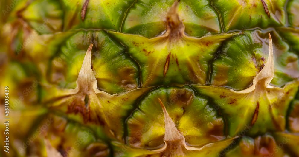 one ripe pineapple close-up, peeled pineapple peel green and yellow one ripe pineapple close-up, peeled pineapple peel green and yellow