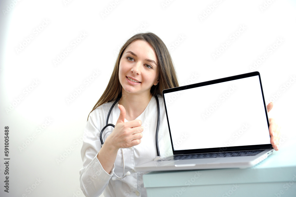 Female doctor in white coat with stethoscope working and typing on laptop computer keyboard at medical office in Hospital. Online medical working, telehealth, telemedicine concept. High quality photo Female doctor in white coat with stethoscope working and typing on laptop computer keyboard at medical office in Hospital. Online medical working, telehealth, telemedicine concept. High quality photo