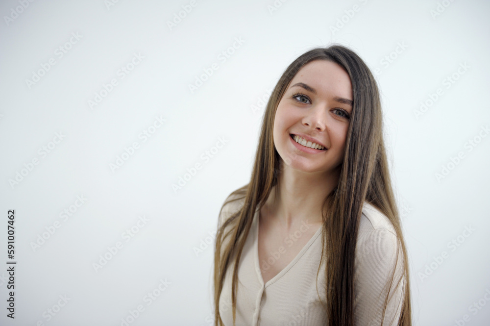 Smiling woman in white shirt touching her face and looks away. isolated portrait. High quality photo Smiling woman in white shirt touching her face and looks away. isolated portrait. High quality photo