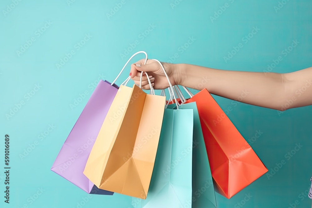 Female Hand Holding Colorful Shopping Bags on Blue Background, AI Generated