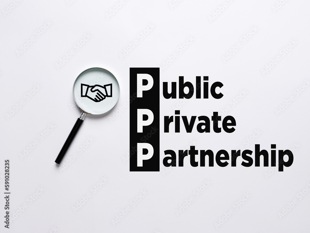 Magnifier magnifies the handshake agreement symbol with the word PPP Public Private Partnership. Magnifier magnifies the handshake agreement symbol with the word PPP Public Private Partnership.