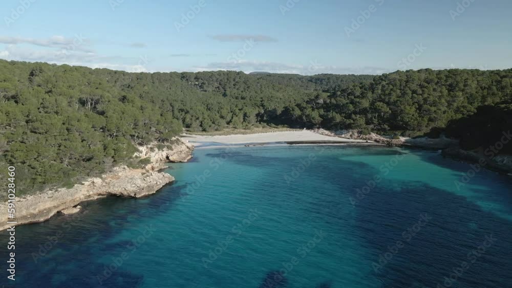 Cinematic aerial flight over hidden beach on the island of Menorca, Spain. Cinematic aerial flight over hidden beach on the island of Menorca, Spain.