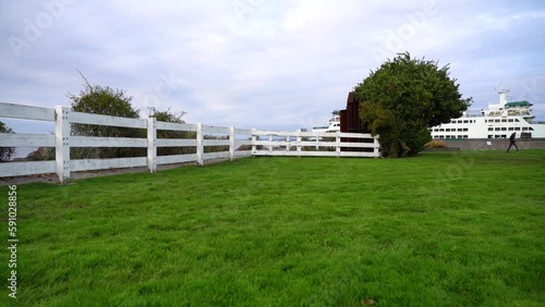 Nice farm on the edge of the sea. Seattle, washington. Very green and well-kept lawn. Cool, rainy weather.