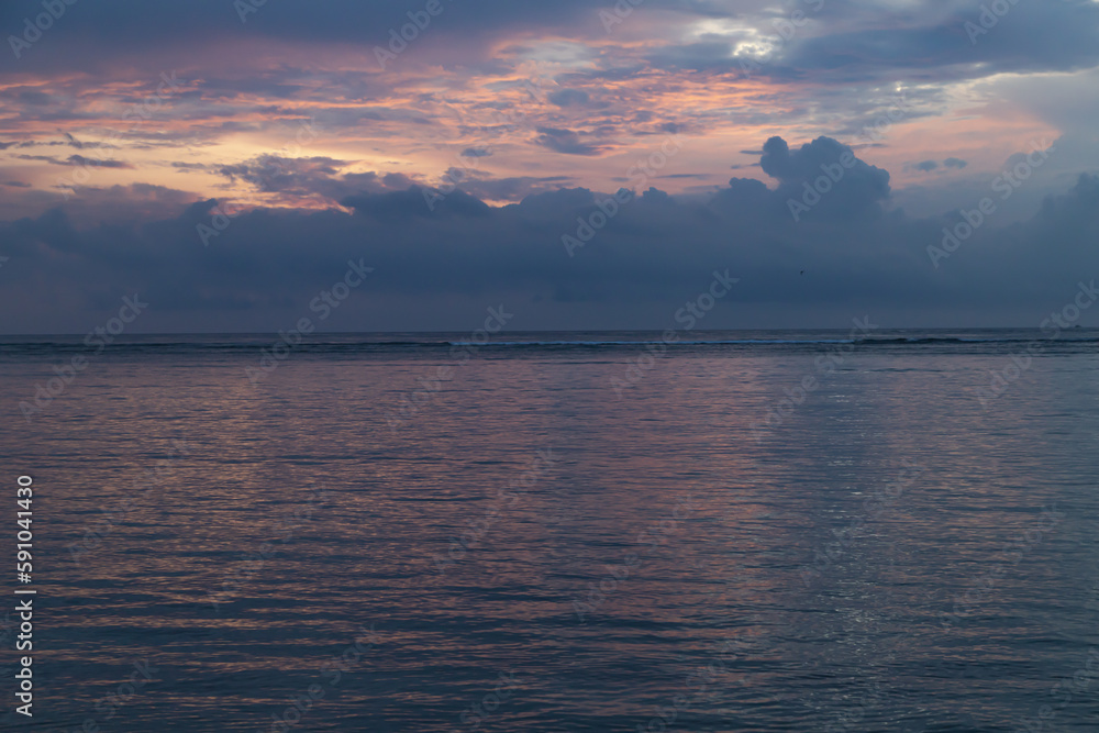 Fototapeta premium Lombok and Gili Air islands, overcast, cloudy day, sky and sea. Sunset, sand beach.