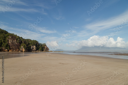 Cliff in Bako national park  sunny day  blue sky and sea. Vacation  travel  tropics concept