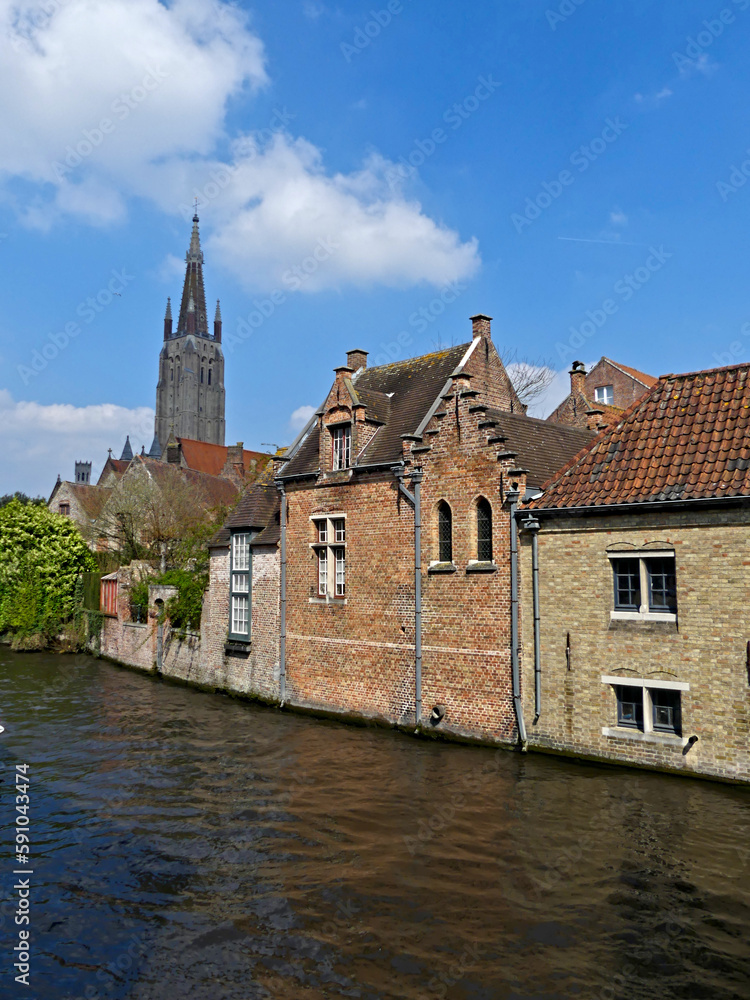 Fototapeta premium Bruges, April 2023: Magnificent facades of the buildings of Bruges, the Venice of the North