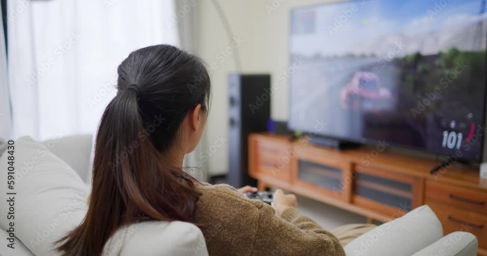 Woman play video game at home Woman play video game at home