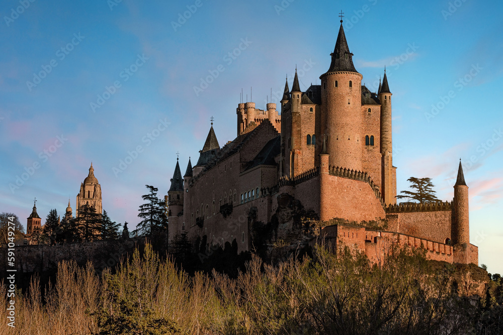 Sunset view of the Segovia Alcázar and the Cathedral in Spain