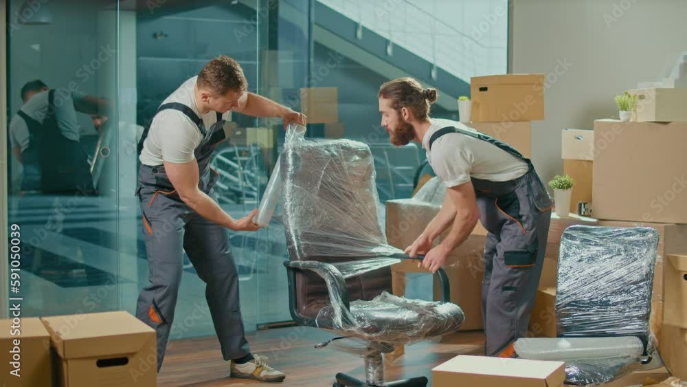 Workers of Moving Company With Uniforms Carefully Packing Furniture. Furniture and Equipment Disassembly and Assembly. Travel insurance. Team of Employee Workers Helps Customers to Relocation. Workers of Moving Company With Uniforms Carefully Packing Furniture. Furniture and Equipment Disassembly and Assembly. Travel insurance. Team of Employee Workers Helps Customers to Relocation.