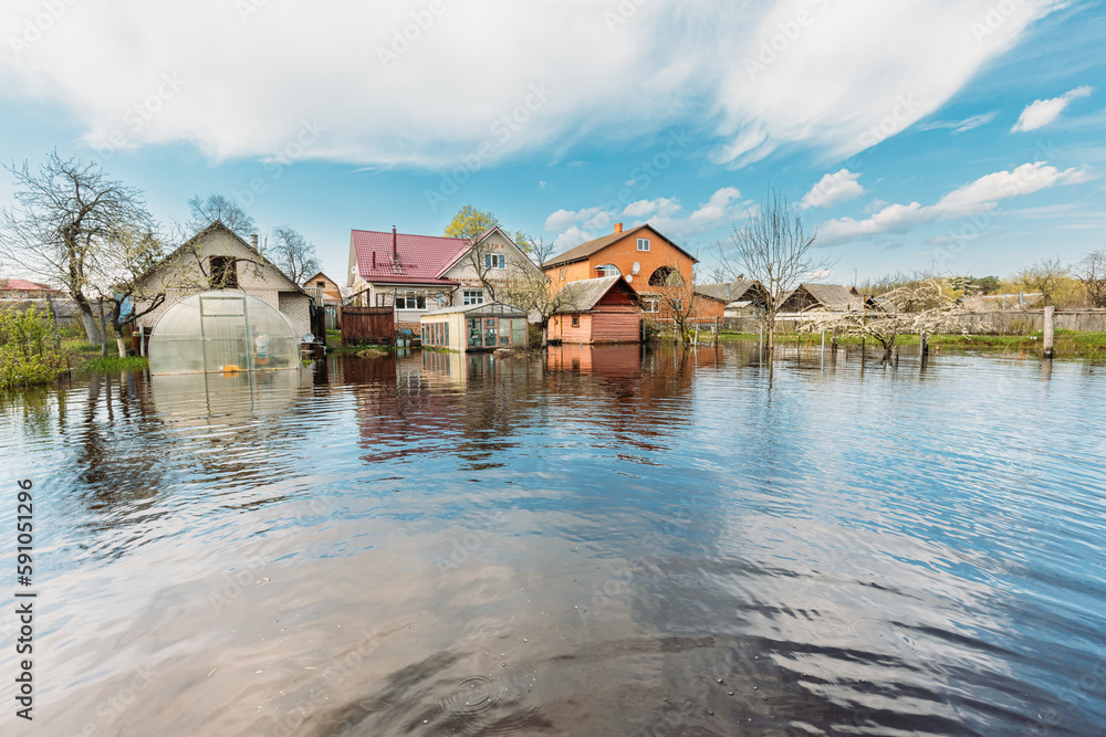 Vegetable Garden Beds In Water During Spring Flood floodwaters during natural disaster. Greenhouse Hothouse in Water deluge During A Spring Flood. inundation River. Vegetable Garden Beds In Water During Spring Flood floodwaters during natural disaster. Greenhouse Hothouse in Water deluge During A Spring Flood. inundation River.