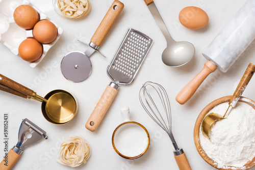 Baking preparation concept with variety utensils and ingredients top view