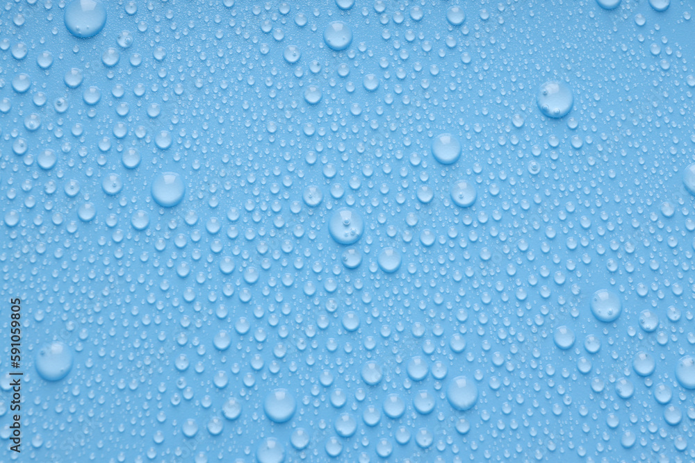Blue background with water drops, close up Blue background with water drops, close up