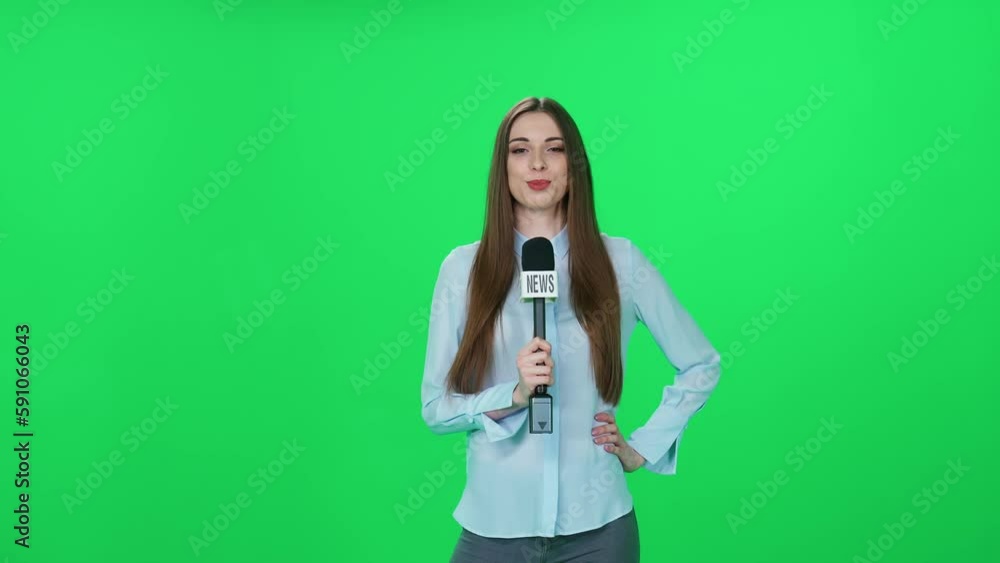 Woman reporter looks into the camera and speaks, green background, template for TV news agencies, journalist at work, breaking news. Woman reporter looks into the camera and speaks, green background, template for TV news agencies, journalist at work, breaking news.