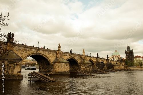 Scenic view of the mediaeval Charles bridge above the tranquil Vltava river in Prague, Czechia