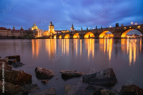 Charles Bridge crossing the Vltava River at night, Prague, Czech Republic