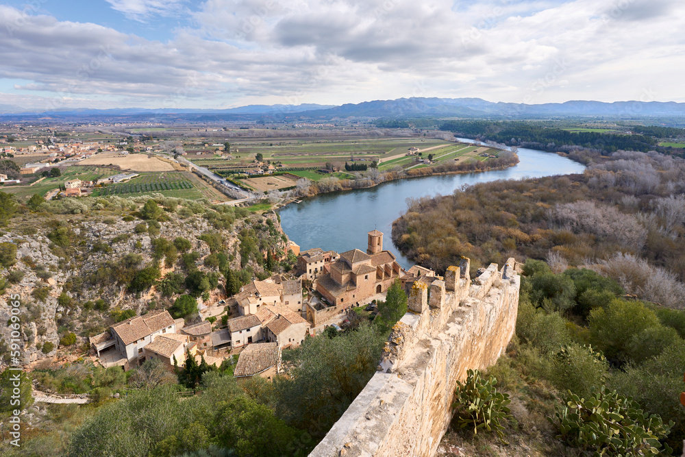 Village and knights templar castle of Miravet at the banks of river Ebro in Catalonia, Spain