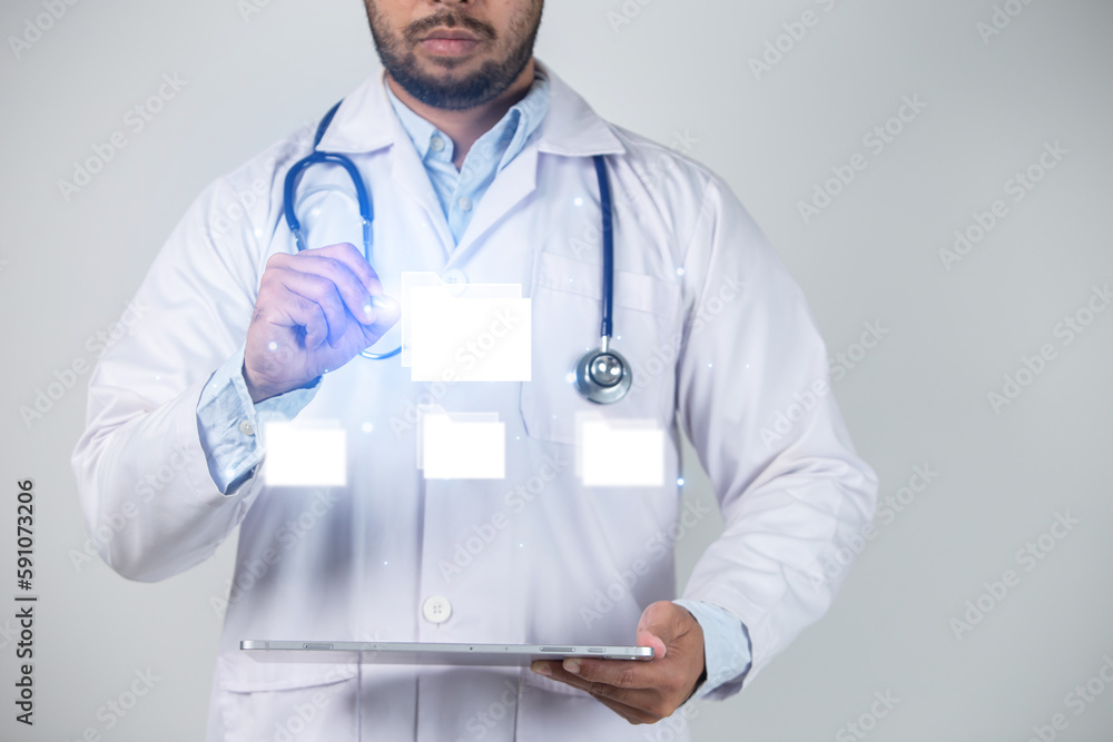 Close-up of male doctor holding tablet pc with glowing medical icons Close-up of male doctor holding tablet pc with glowing medical icons