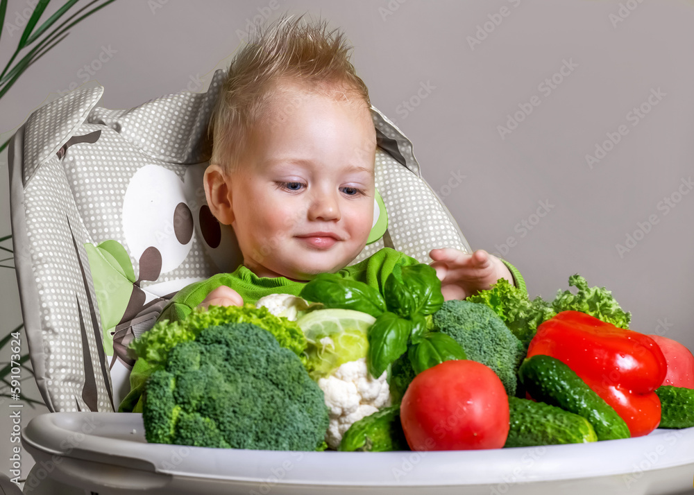 Baby feeding. Acquaintance of the baby with fresh vegetables Baby feeding. Acquaintance of the baby with fresh vegetables