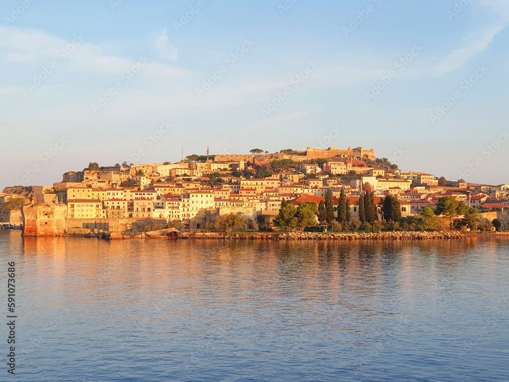 View from the sea to the city of Portoferraio at sunrise.