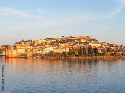 View from the sea to the city of Portoferraio at sunrise.