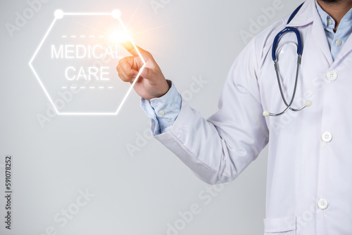 Doctor working on virtual screen with medical care text. Healthcare and medical concept.