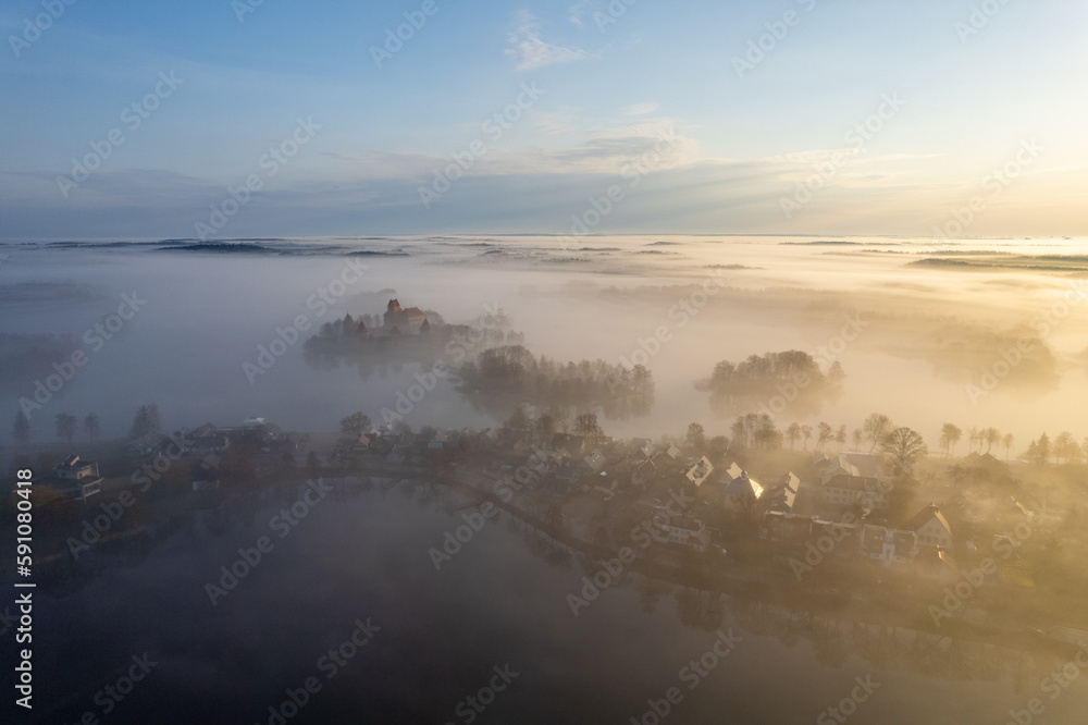 Aerial beautiful spring morning fog view of Trakai Castle, Lithuania