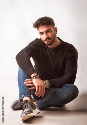 Full body shot of handsome young man with shirt and jeans