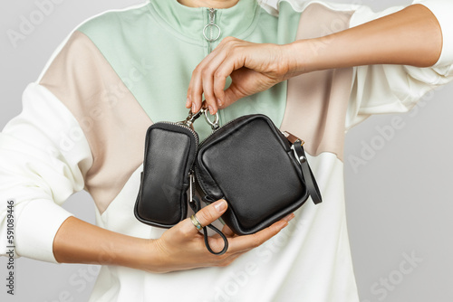 Female Hands Holding Small Leather Coin Purses